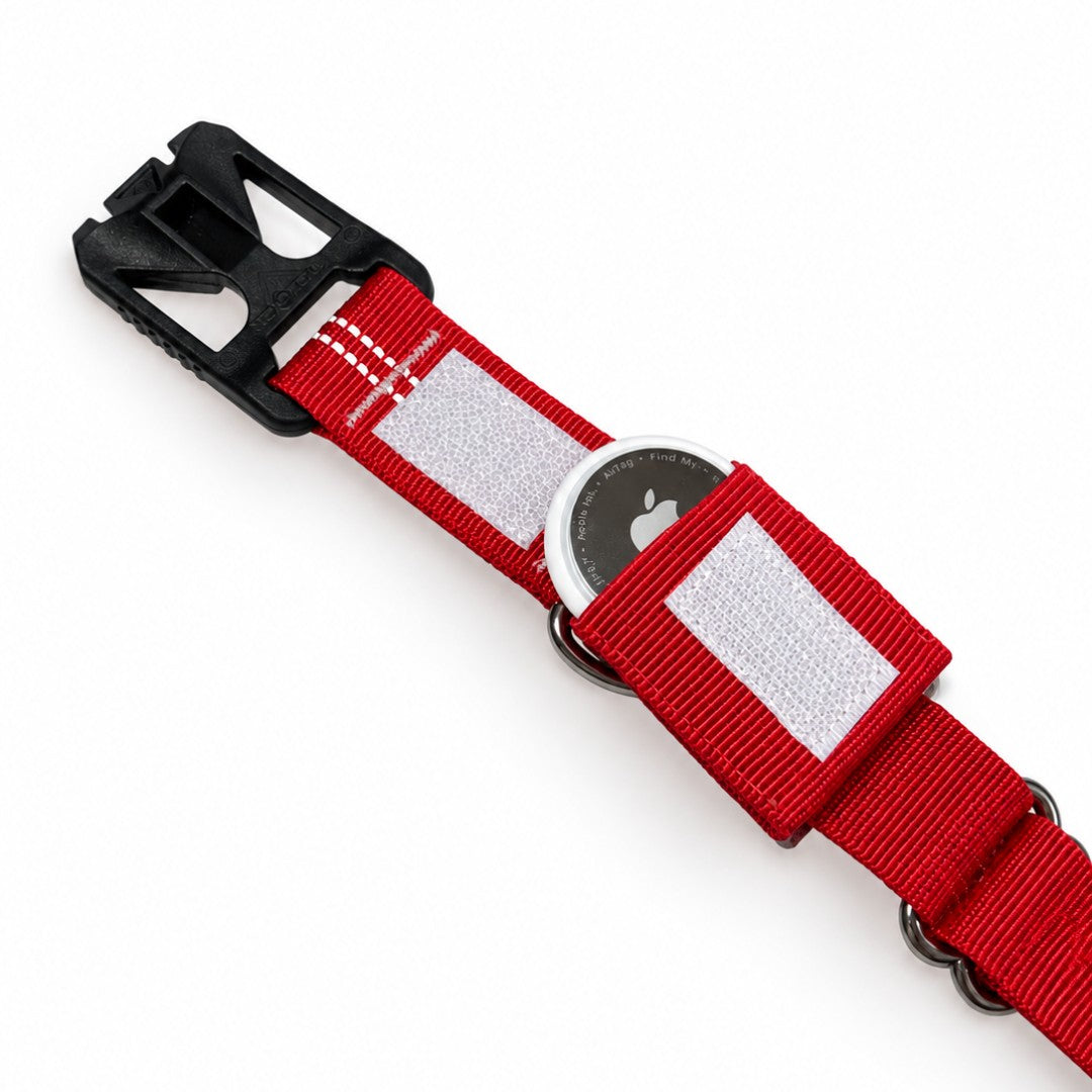 An Apple AirTag held inside the TagPouch on the inside of a red collar